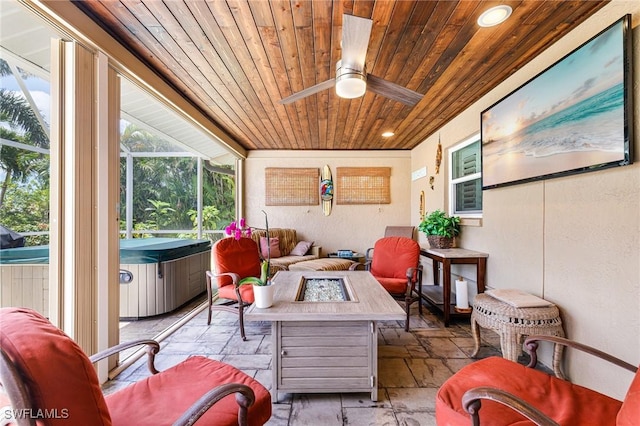 2912 SW 1st Ter, Cape Coral, FL 33991 - sunroom / solarium featuring a hot tub, a ceiling fan, and an outdoor living space with a fire pit