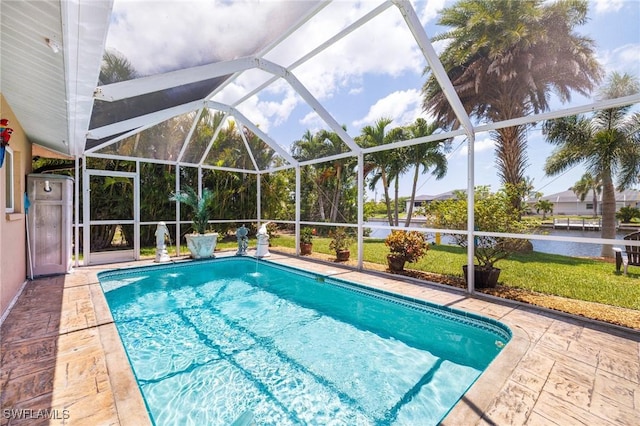 2912 SW 1st Ter, Cape Coral, FL 33991 - swimming pool featuring a water view, a lanai, and a patio area