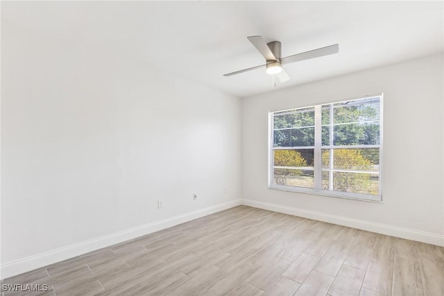 unfurnished room with light wood-style flooring, baseboards, and ceiling fan