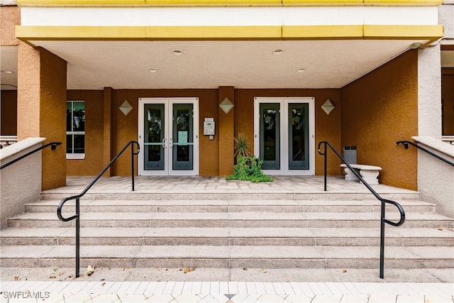 2825 Palm Beach Blvd Unit 203, Fort Myers, FL 33916 - property entrance featuring french doors, stucco siding, and a porch