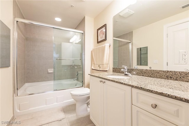 2825 Palm Beach Blvd Unit 203, Fort Myers, FL 33916 - full bathroom featuring tile patterned flooring, toilet, enclosed tub / shower combo, vanity, and recessed lighting