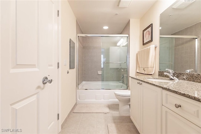 2825 Palm Beach Blvd Unit 203, Fort Myers, FL 33916 - full bathroom with tile patterned floors, vanity, toilet, enclosed tub / shower combo, and recessed lighting