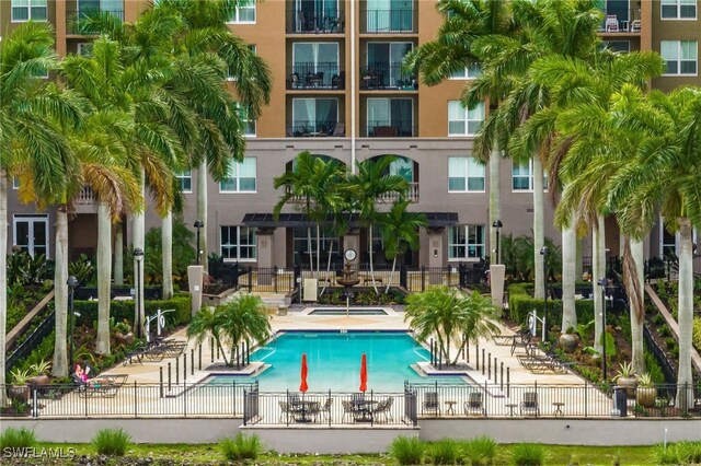2825 Palm Beach Blvd Unit 203, Fort Myers, FL 33916 - community pool featuring fence and a patio