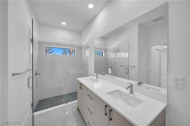 1904 E 11th St, Lehigh Acres, FL 33936 - bathroom featuring a shower stall, double vanity, and recessed lighting