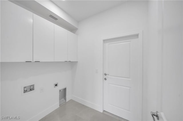 1904 E 11th St, Lehigh Acres, FL 33936 - clothes washing area with cabinet space, electric dryer hookup, washer hookup, and baseboards