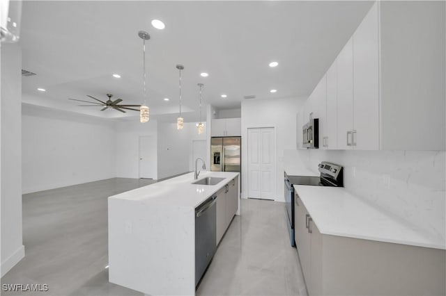1904 E 11th St, Lehigh Acres, FL 33936 - kitchen with stainless steel appliances, recessed lighting, white cabinets, a sink, and modern cabinets