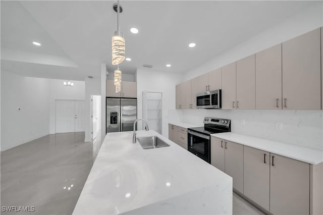 1904 E 11th St, Lehigh Acres, FL 33936 - kitchen featuring stainless steel appliances, a sink, recessed lighting, hanging light fixtures, and decorative backsplash