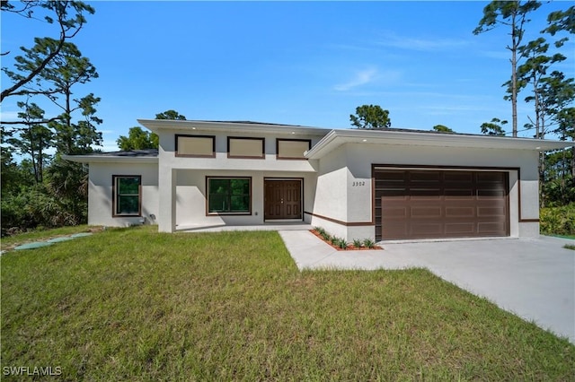 1904 E 11th St, Lehigh Acres, FL 33936 - view of front of home featuring stucco siding, concrete driveway, a garage, and a front yard