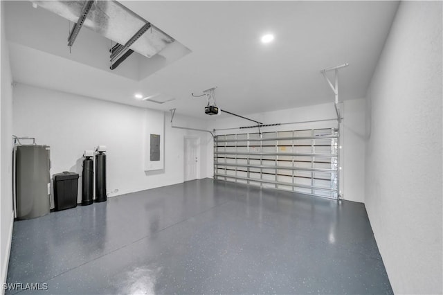 1904 E 11th St, Lehigh Acres, FL 33936 - garage with electric panel, a garage door opener, and recessed lighting