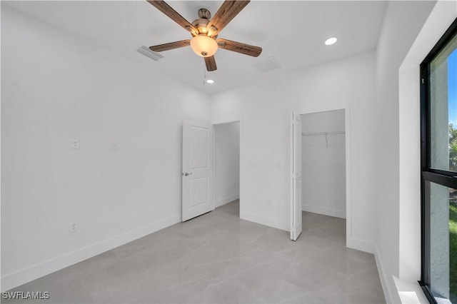 1904 E 11th St, Lehigh Acres, FL 33936 - unfurnished bedroom with baseboards, recessed lighting, a walk in closet, ceiling fan, and a closet