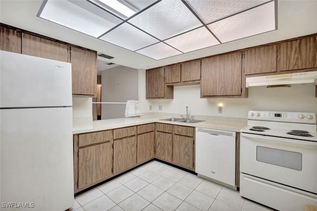4508 Santa Barbara Blvd Unit 103, Cape Coral, FL 33914 - kitchen featuring white appliances, a sink, under cabinet range hood, light countertops, and light tile patterned floors
