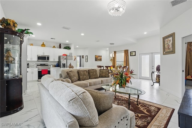4174 58th Ave NE, Naples, FL 34120 - living area featuring light marble finish floors and recessed lighting