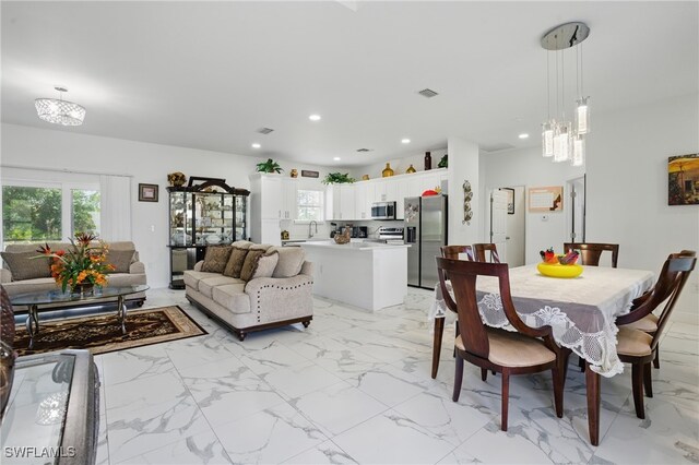 4174 58th Ave NE, Naples, FL 34120 - dining room with recessed lighting and light marble finish floors