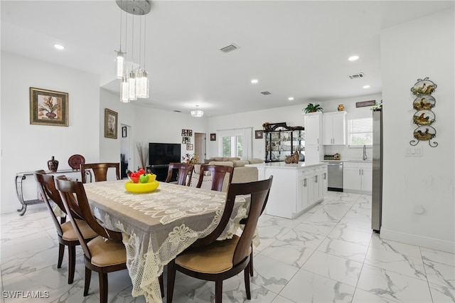4174 58th Ave NE, Naples, FL 34120 - dining room with light marble finish floors, recessed lighting, baseboards, and a chandelier