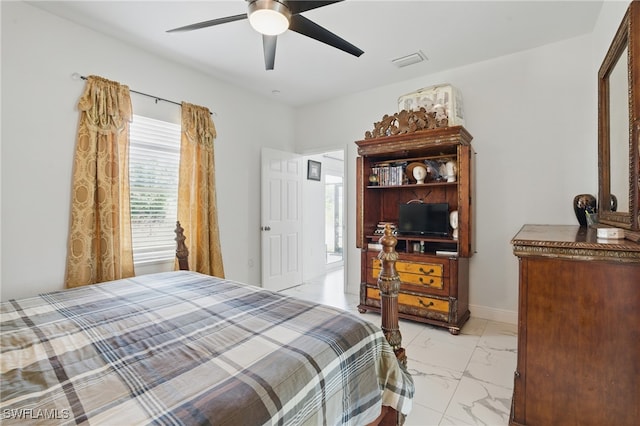 4174 58th Ave NE, Naples, FL 34120 - bedroom featuring light marble finish floors and ceiling fan