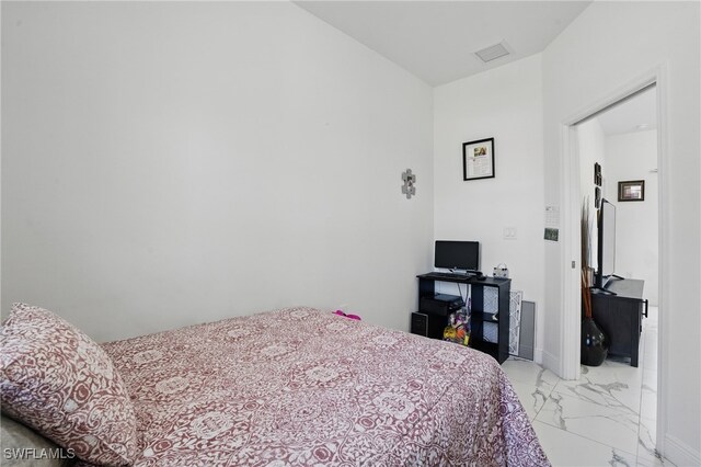 4174 58th Ave NE, Naples, FL 34120 - bedroom with light marble finish floors