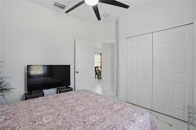 4174 58th Ave NE, Naples, FL 34120 - bedroom with light marble finish floors, a closet, and ceiling fan