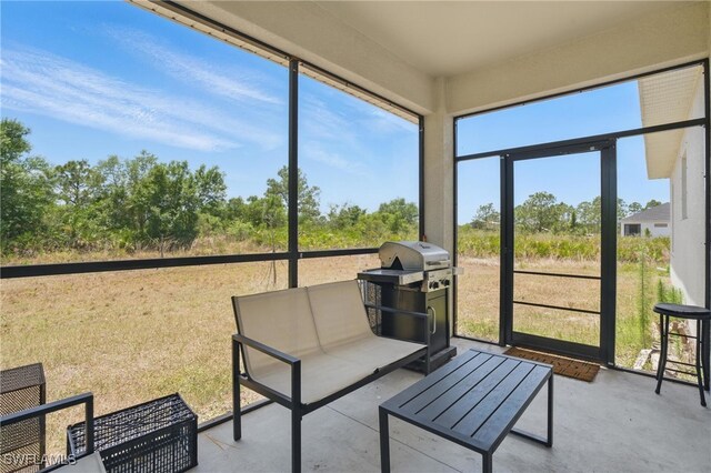 4174 58th Ave NE, Naples, FL 34120 - sunroom with outdoor lounge area