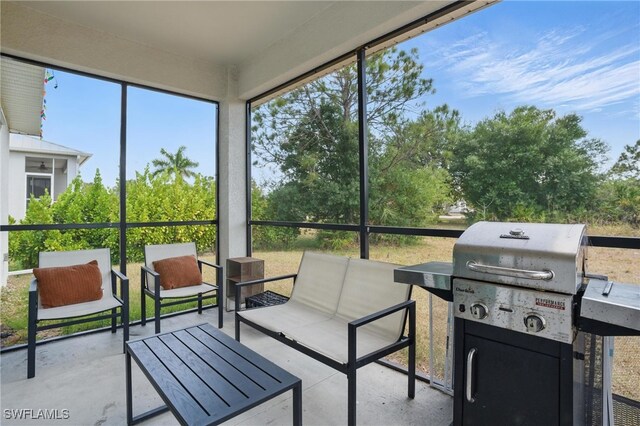 4174 58th Ave NE, Naples, FL 34120 - sunroom with outdoor lounge area