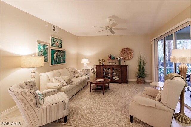 1878 Tarpon Bay Dr S Unit 102, Naples, FL 34119 - living area featuring ceiling fan, baseboards, and light colored carpet