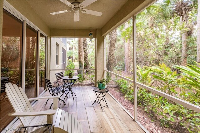 1878 Tarpon Bay Dr S Unit 102, Naples, FL 34119 - sunroom / solarium featuring a ceiling fan