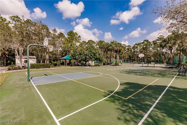 1878 Tarpon Bay Dr S Unit 102, Naples, FL 34119 - view of basketball court featuring community basketball court and view of wooded area