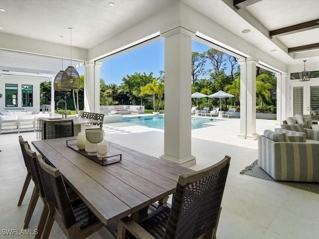 186 N St, Naples, FL 34108 - view of patio / terrace with outdoor dining area, an outdoor pool, an outdoor living space, and french doors