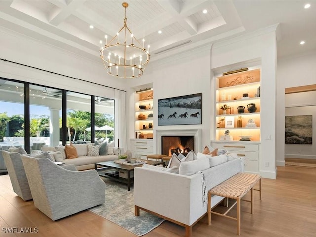 186 N St, Naples, FL 34108 - living area with recessed lighting, light wood-style floors, beamed ceiling, built in features, and a lit fireplace