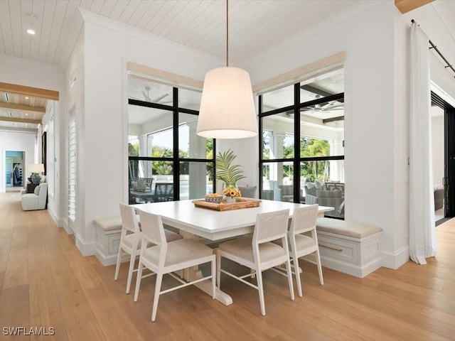 186 N St, Naples, FL 34108 - dining room with light wood-style floors, wood ceiling, crown molding, recessed lighting, and baseboards