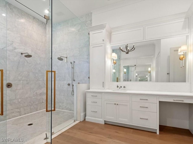 186 N St, Naples, FL 34108 - bathroom featuring a stall shower, wood finished floors, and vanity