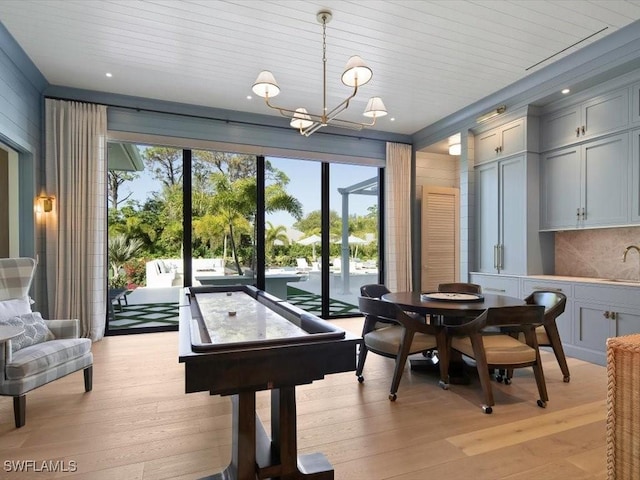 186 N St, Naples, FL 34108 - game room with a chandelier, light wood-style floors, a sink, and recessed lighting