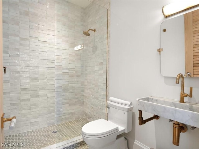 186 N St, Naples, FL 34108 - bathroom featuring toilet, a shower stall, and baseboards