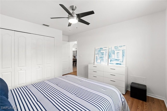 2210 SW 14th Ave, Cape Coral, FL 33991 - bedroom featuring a closet, wood finished floors, and a ceiling fan
