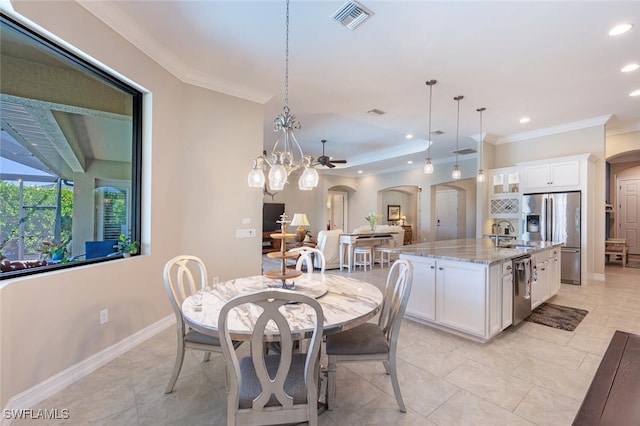 1456 Mockingbird Dr, Naples, FL 34120 - dining room with arched walkways, crown molding, recessed lighting, baseboards, and a chandelier
