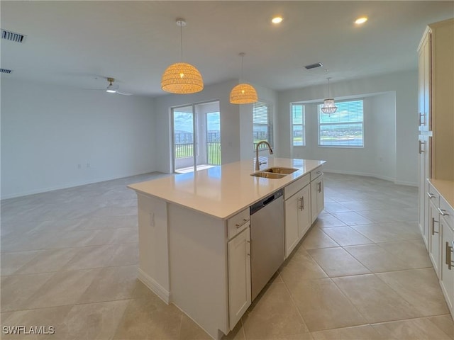 5583 Double Eagle Cir Unit 4141, Ave Maria, FL 34142 - kitchen featuring dishwasher, a sink, light countertops, baseboards, and light tile patterned floors