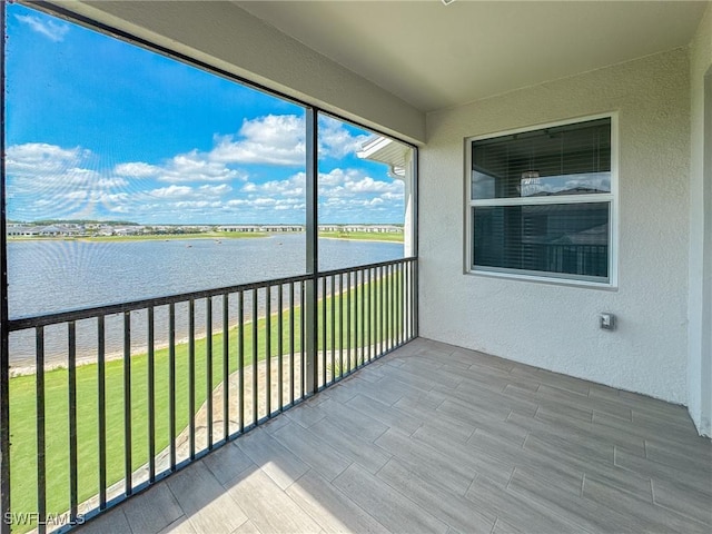 5583 Double Eagle Cir Unit 4141, Ave Maria, FL 34142 - unfurnished sunroom with a water view