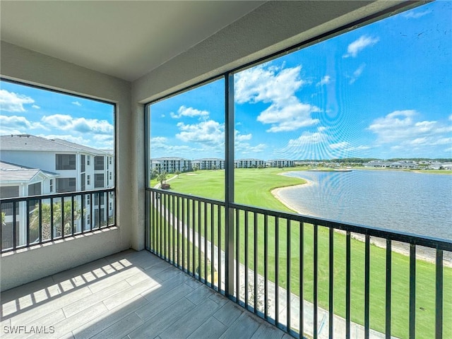 5583 Double Eagle Cir Unit 4141, Ave Maria, FL 34142 - unfurnished sunroom featuring a water view