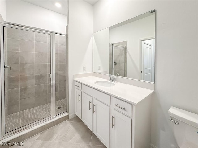 5583 Double Eagle Cir Unit 4141, Ave Maria, FL 34142 - bathroom with vanity, a shower stall, toilet, and tile patterned flooring