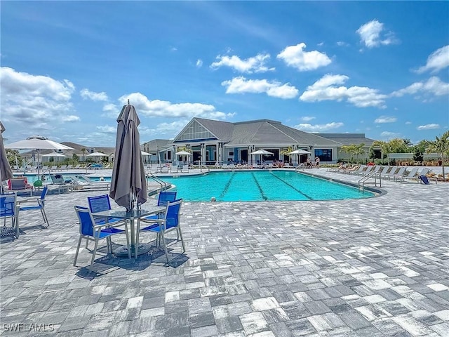 5583 Double Eagle Cir Unit 4141, Ave Maria, FL 34142 - community pool featuring a patio area