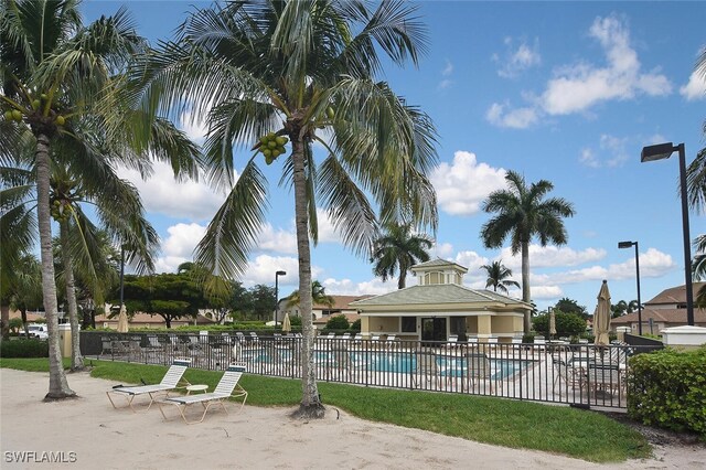 3880 Sawgrass Way Unit 2423, Naples, FL 34112 - community pool with fence and a patio
