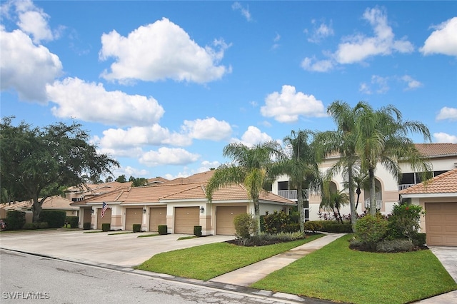 3880 Sawgrass Way Unit 2423, Naples, FL 34112 - view of front of home featuring a tile roof, stucco siding, and a front yard
