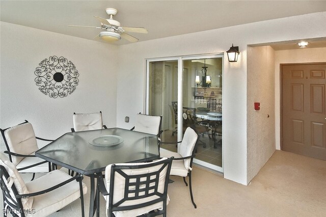 3880 Sawgrass Way Unit 2423, Naples, FL 34112 - dining area with a ceiling fan and a textured wall