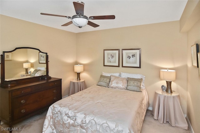 3880 Sawgrass Way Unit 2423, Naples, FL 34112 - bedroom with carpet flooring, baseboards, and a ceiling fan