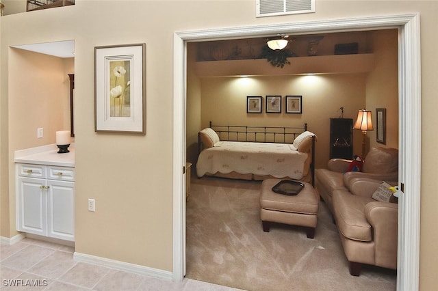 3880 Sawgrass Way Unit 2423, Naples, FL 34112 - bedroom featuring baseboards and light tile patterned floors