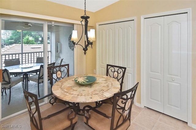 3880 Sawgrass Way Unit 2423, Naples, FL 34112 - dining room with light tile patterned floors, baseboards, and vaulted ceiling