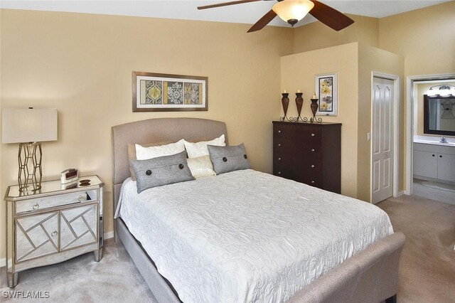 3880 Sawgrass Way Unit 2423, Naples, FL 34112 - bedroom featuring carpet, connected bathroom, baseboards, and a sink