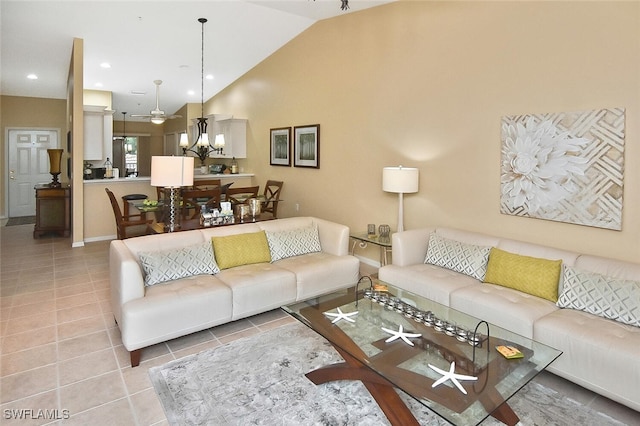 3880 Sawgrass Way Unit 2423, Naples, FL 34112 - living area with tile patterned floors, baseboards, a chandelier, and high vaulted ceiling