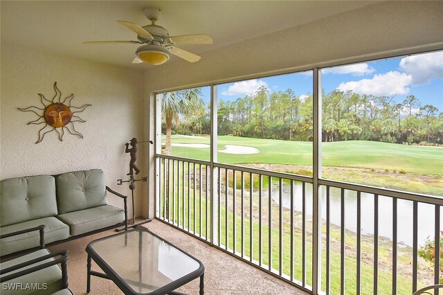 3880 Sawgrass Way Unit 2423, Naples, FL 34112 - sunroom featuring golf course view, ceiling fan, and view of scattered trees