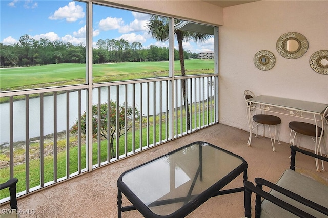 3880 Sawgrass Way Unit 2423, Naples, FL 34112 - sunroom / solarium with view of golf course, a water view, and view of scattered trees
