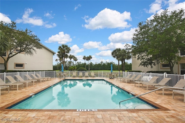 3880 Sawgrass Way Unit 2423, Naples, FL 34112 - community pool featuring a patio and fence
